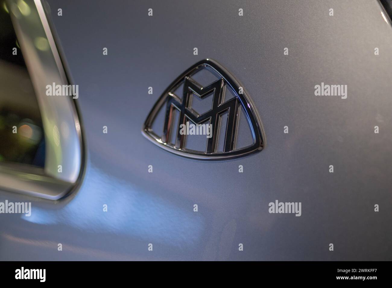 closeup badge logo electric silver Maybach GLS SUV, car EV Mercedes-Benz Group, environmental cleanliness vehicle, Innovation in automotive industry s Stock Photo