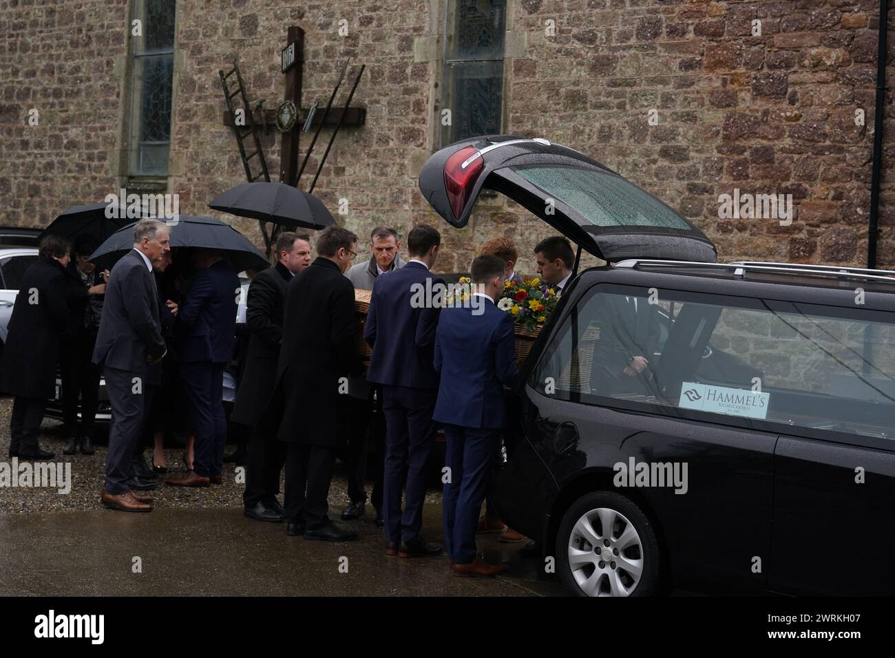 Pall bearers carry the casket from the hearse at the funeral of TV ...