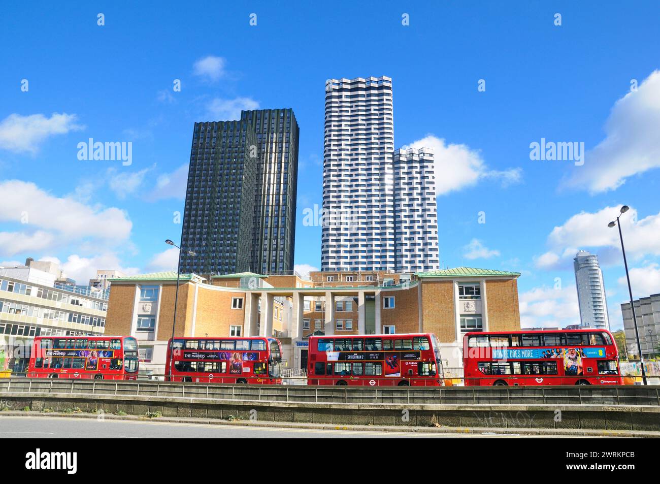 Double decker red buses outside Croydon College with HTA Design   buildings Ten Degrees and College Road Europe's tallest modular residential building Stock Photo