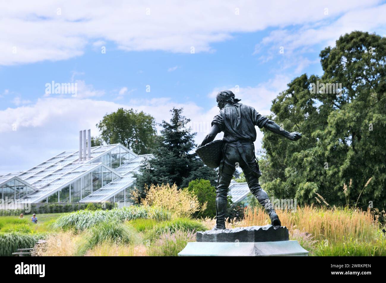 The Sower statue by Hamo Thornycroft in the Grass Garden near the Princess of Wales Conservatory, Royal Botanic Gardens, Kew, London, UK. Kew Gardens Stock Photo