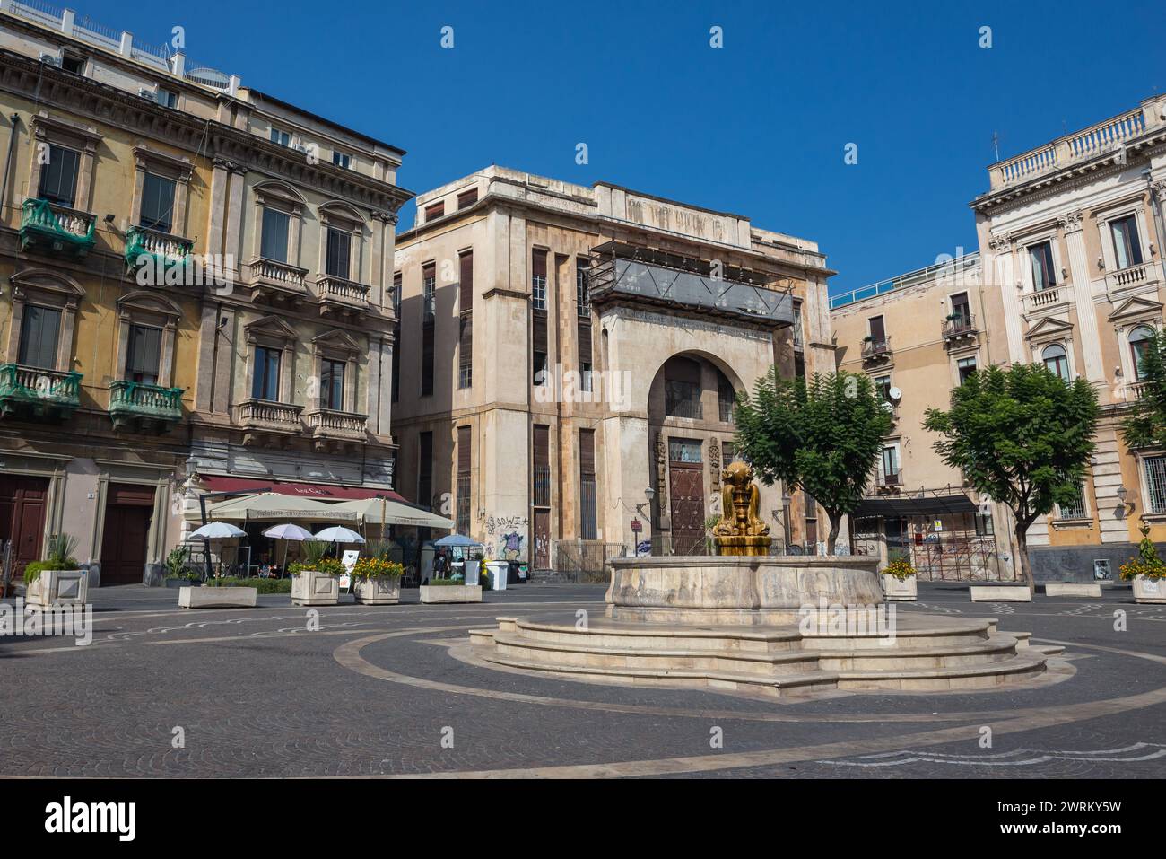 Casa Del Mutilato and fountain on Vincenzo Bellini Square in historic part of Catania city on the island of Sicily, Italy Stock Photo