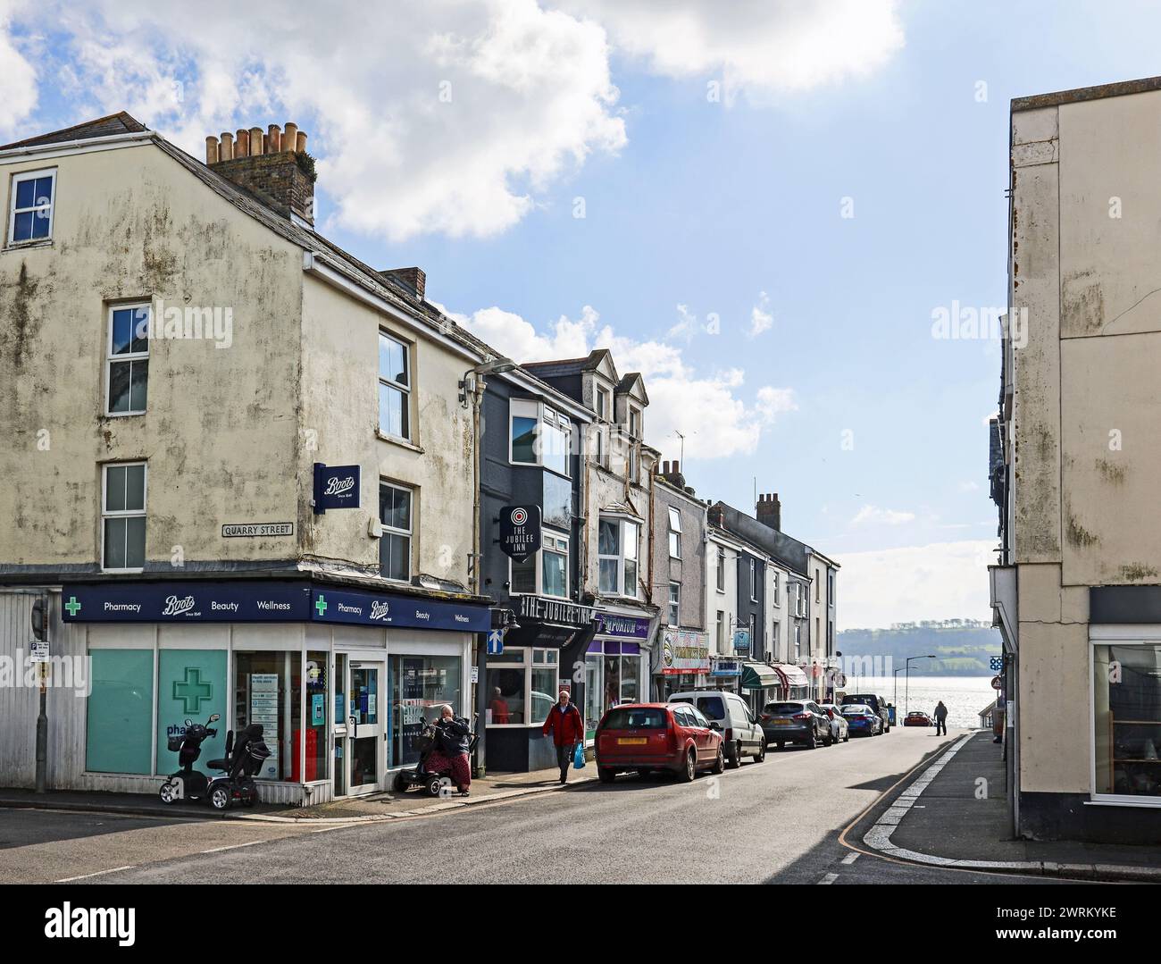 Shops at Fore Street, Torpoint in south east Cornwall. The bottom end looking towards the River Tamar and Mount Edgcumbe. Stock Photo