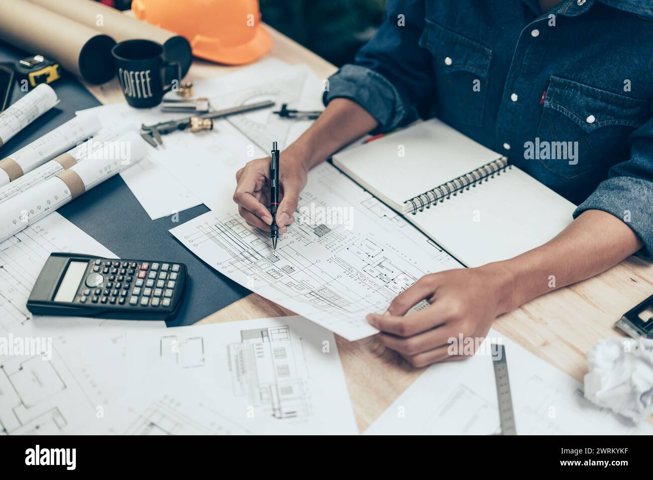 Architect engineer use pen drawing design working on blueprint. House ...