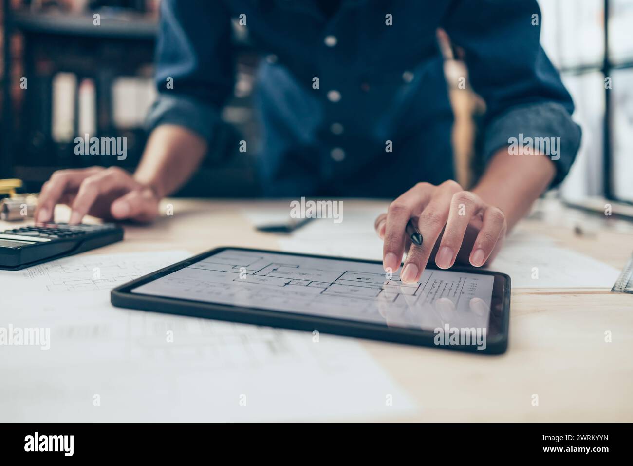 Architect engineer use tablet to read drawing design. House planning ...