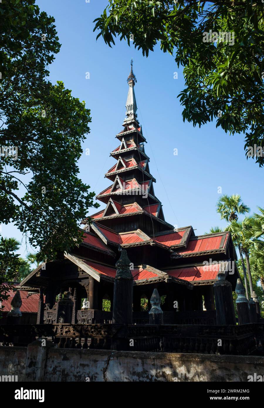 Seven-tiered spire of Bagaya Monastery - teak wood buddhist monastery in Inwa (Ava), Myanmar Stock Photo