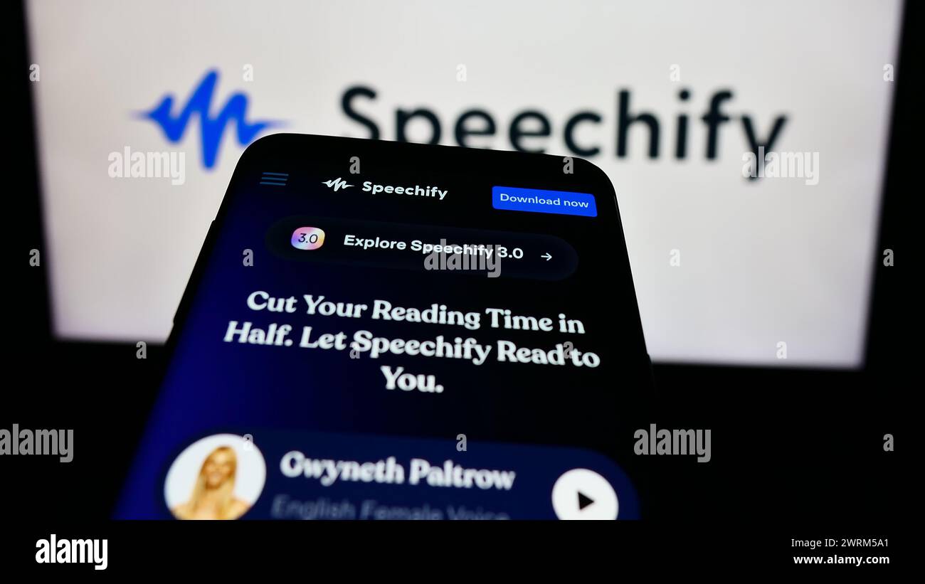 Smartphone with website of text-to-speech app company Speechify Inc. in front of business logo. Focus on top-left of phone display. Stock Photo