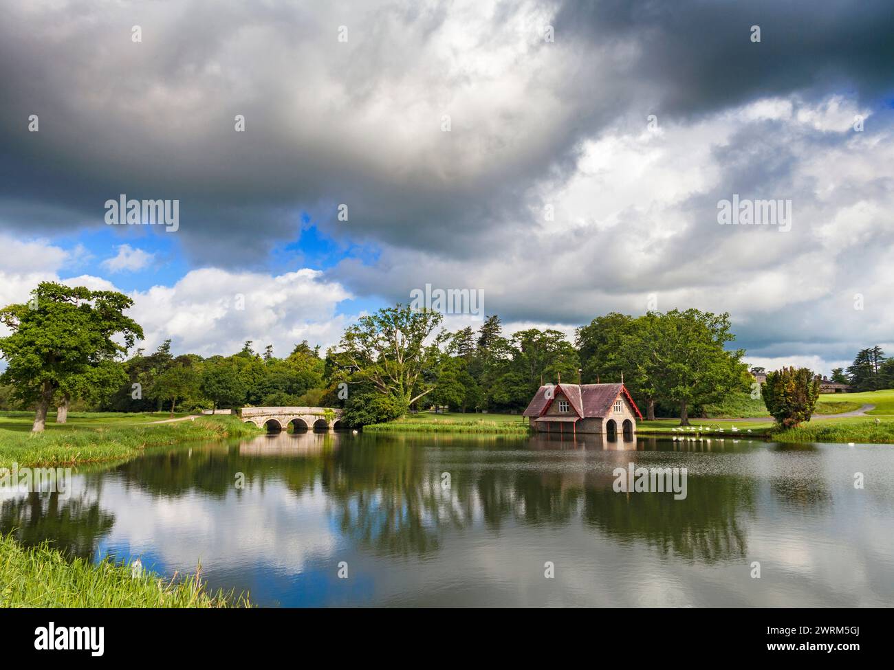 The 19th-century Boat House  and 18th-century bridge,on Rye Water in the Carton House estate  in County KIldare, Ireland, Stock Photo