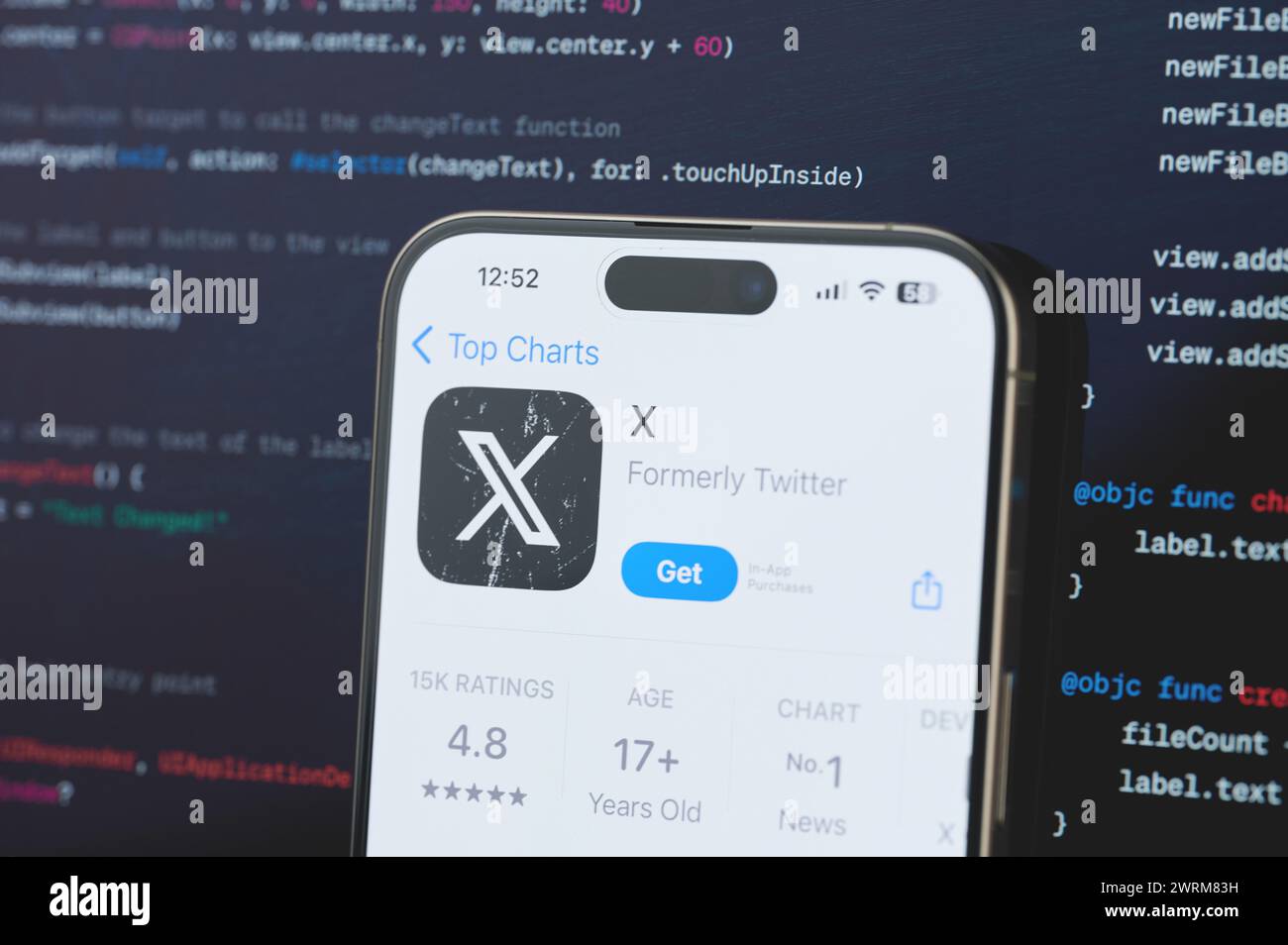 New York, USA - February 23, 2024: X on iphone screen in blurred code ...