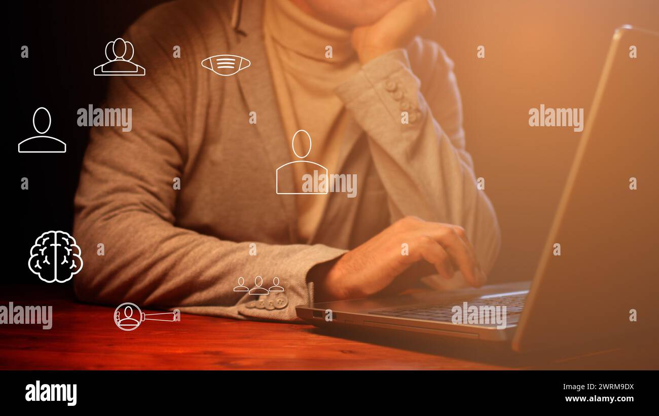 Cg tech collage. Symbols of digitalization of communications against the background of a silhouette of a businessman at a laptop Stock Photo