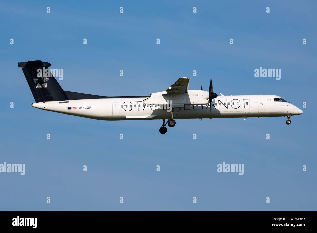 Vienna, Austria - May 20, 2018: Star Alliance Austrian Airlines Bombardier DHC-8 Q400 OE-LGP passenger plane arrival and landing at Vienna Airport Stock Photo