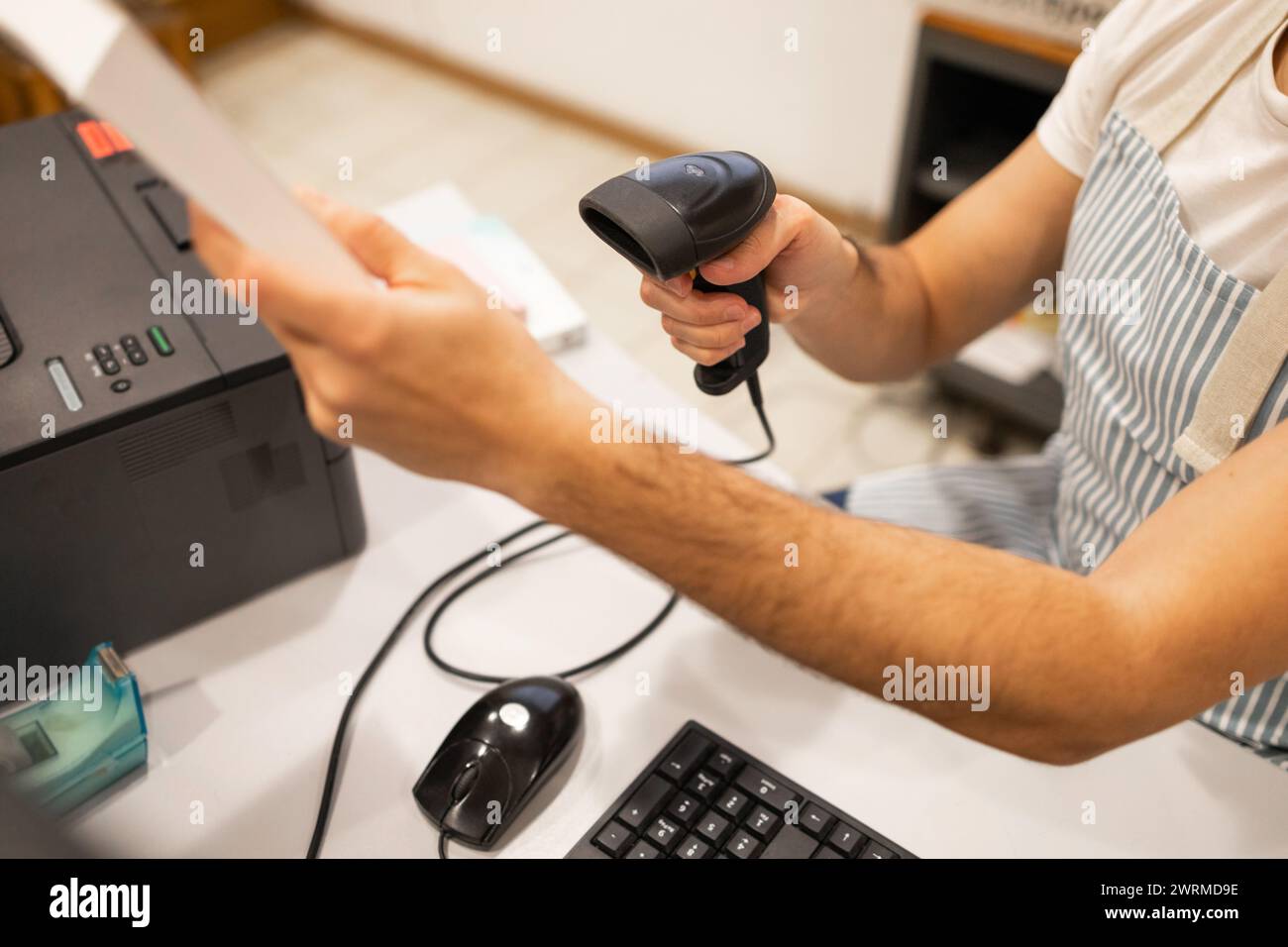 Inventory management employee scanning hi-res stock photography and ...