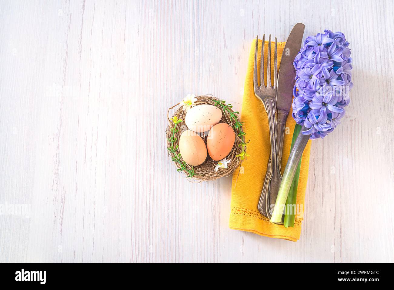Festive place setting for easter dinner Stock Photo
