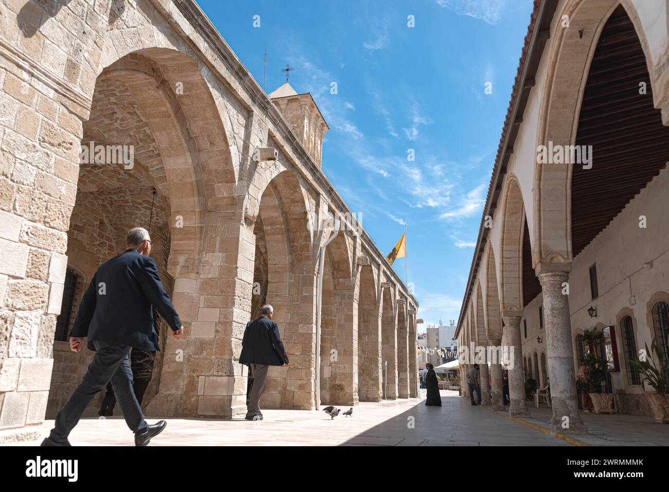 Larnaca, Cyprus - April 21, 2022: People walking in the courtyard of Church of Saint Lazarus Stock Photo