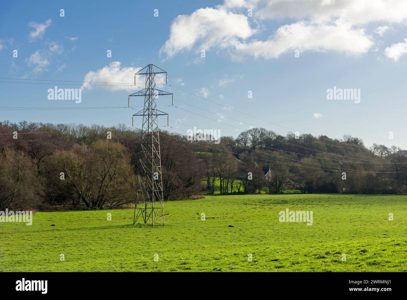 Overhead 132kv electricity transmission cables and transmission tower in the countryside near Stogumber, Somerset, England. Stock Photo