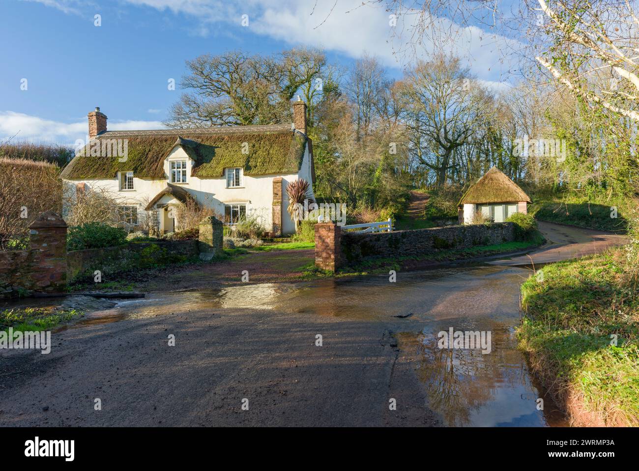 A cottage at the hamlet of Escott near Stogumber with the Quantock Hills beyond, Somerset, England. Stock Photo