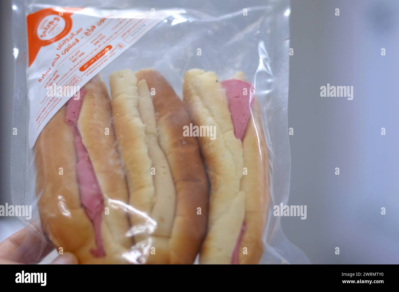 Cairo, Egypt March 2 2024: Wagbety Wagbati sandwiches, three buns stuffed with chicken luncheon and beef luncheons, a snack and a quick meal, selectiv Stock Photo