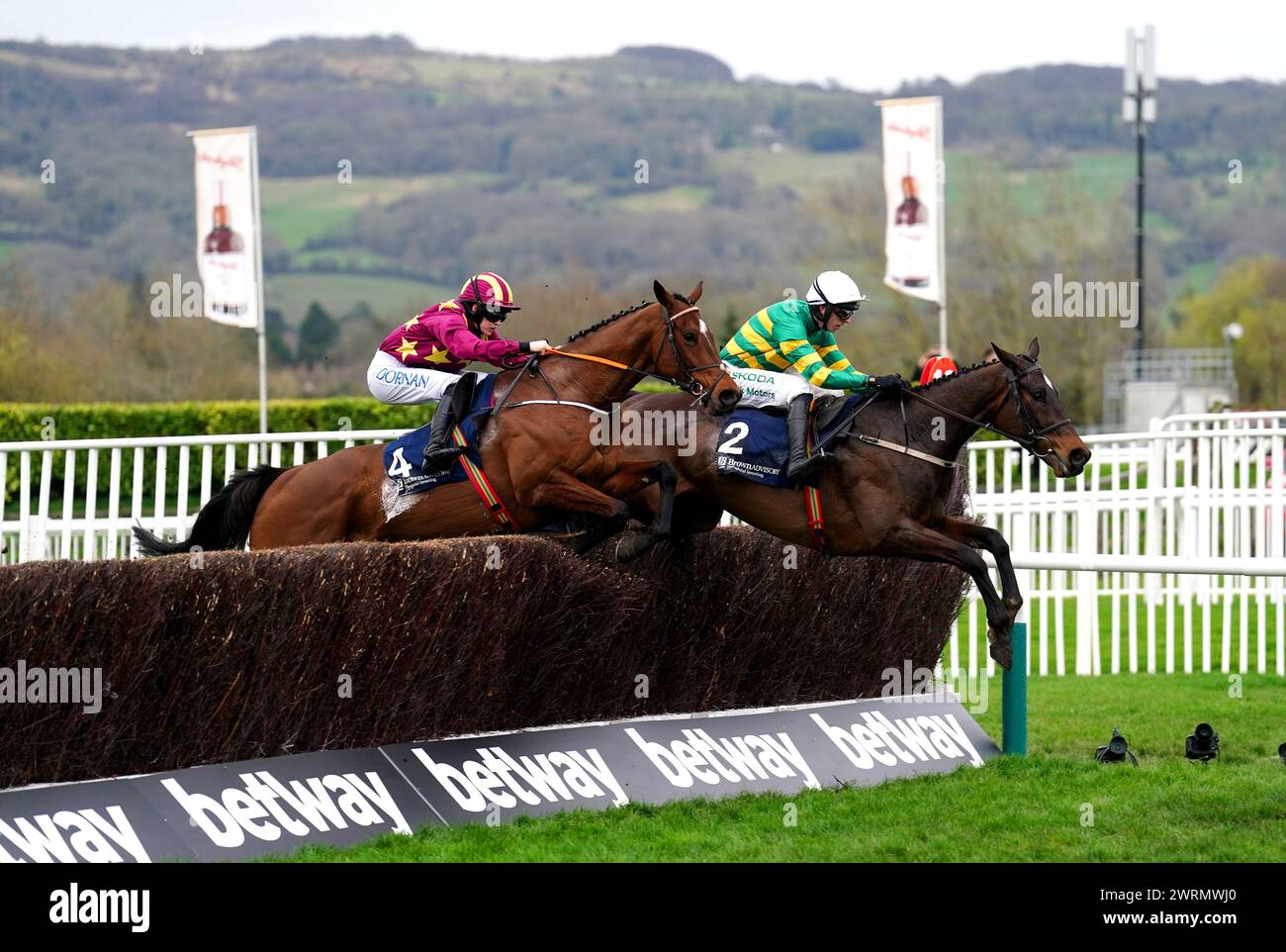 Fact To File ridden by jockey Mark Walsh (right) on their way to winning the Brown Advisory Novices' Chase on day two of the 2024 Cheltenham Festival at Cheltenham Racecourse. Picture date: Wednesday March 13, 2024. Stock Photo