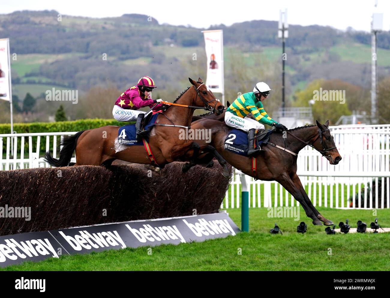 Fact To File ridden by jockey Mark Walsh (right) on their way to winning the Brown Advisory Novices' Chase on day two of the 2024 Cheltenham Festival at Cheltenham Racecourse. Picture date: Wednesday March 13, 2024. Stock Photo