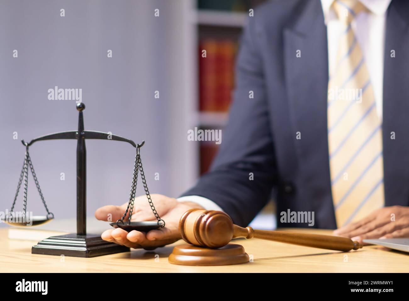 Brass scales are placed on lawyers desks in legal advice offices as a symbol of fairness and integrity in the High Court decision making. Brass scales Stock Photo