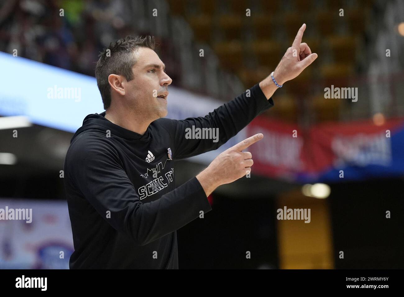 Chattanooga head coach Shawn Poppie directs his team against Mercer during an NCAA women's semi