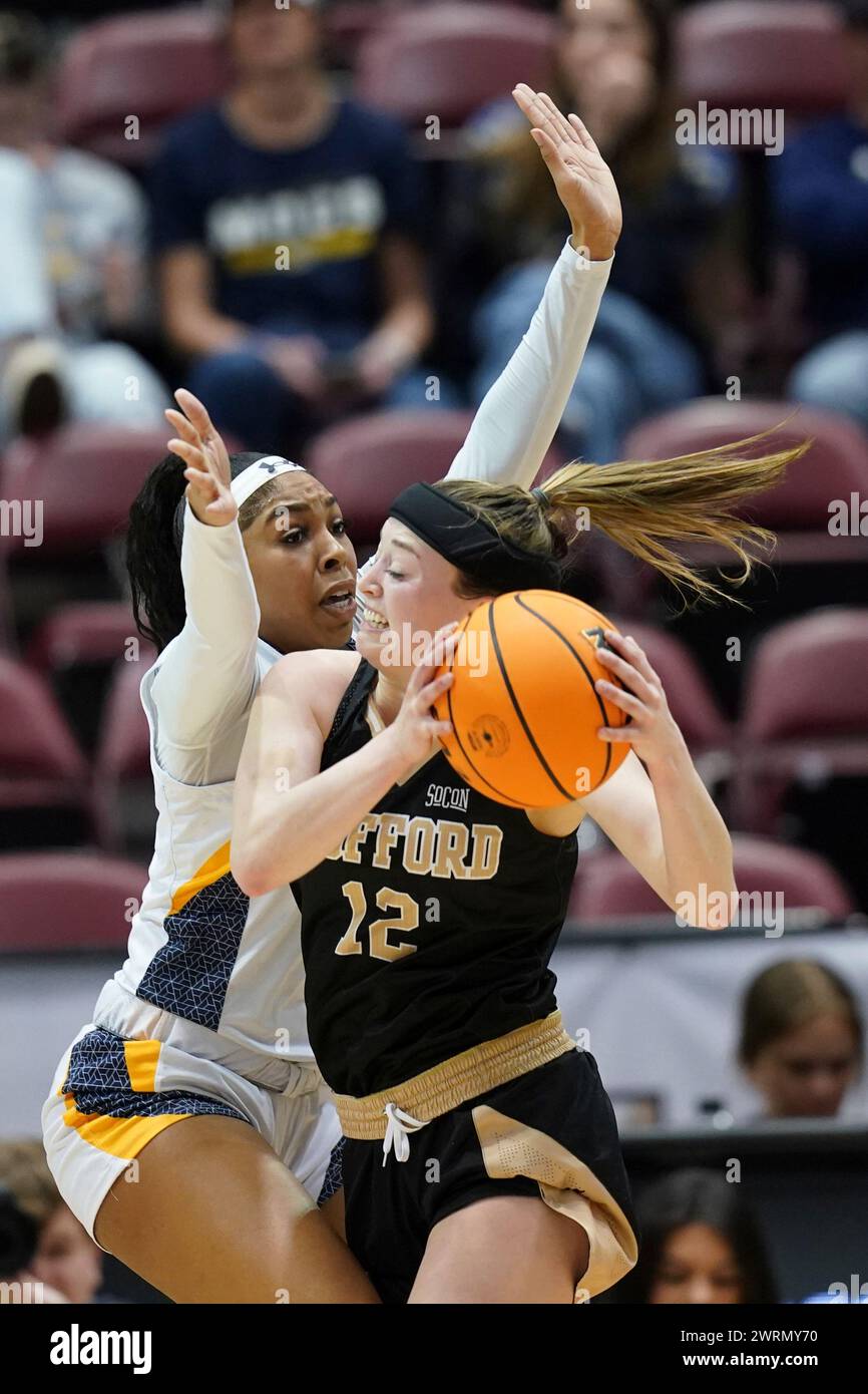 UNC Greensboro guard Makiah Asidanya (21) defends against Wofford guard Rachael Rose (12) during