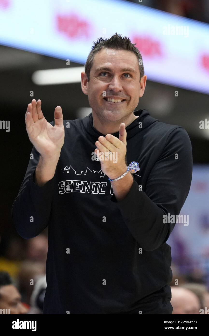 Chattanooga head coach Shawn Poppie applauds his team during an NCAA women's semi final college