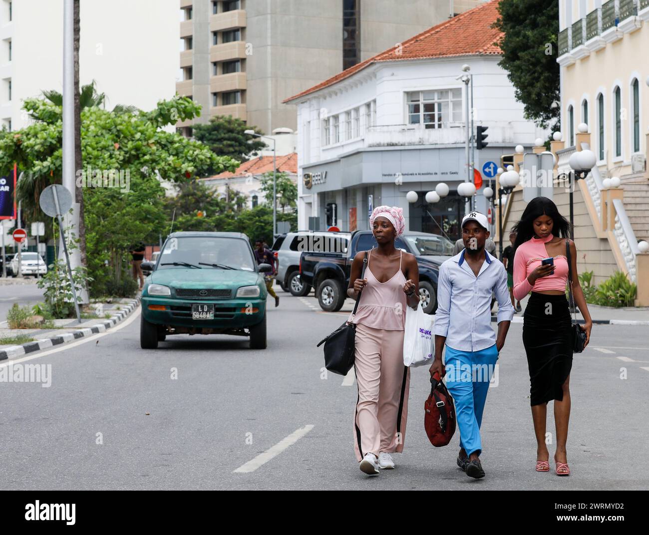 Luanda, Angola. 9th Mar, 2024. People walk on a street in Luanda