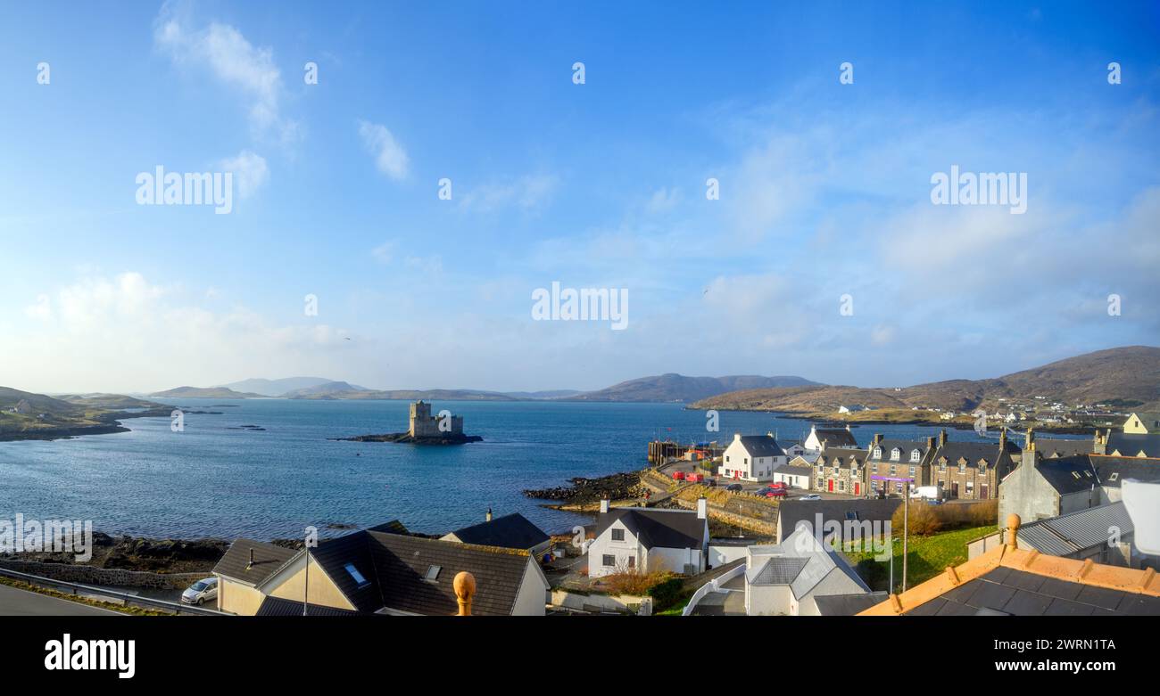 View over the village of Castlebay and Kisimul Castle in the early morning, Isle of Barra, Outer Hebrides, Scotland, UK Stock Photo