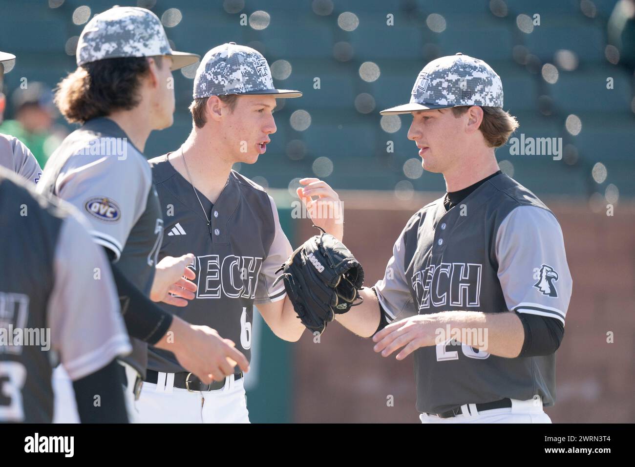 Tennessee Tech pitcher Eli Huddleston (28) is greeted back to the