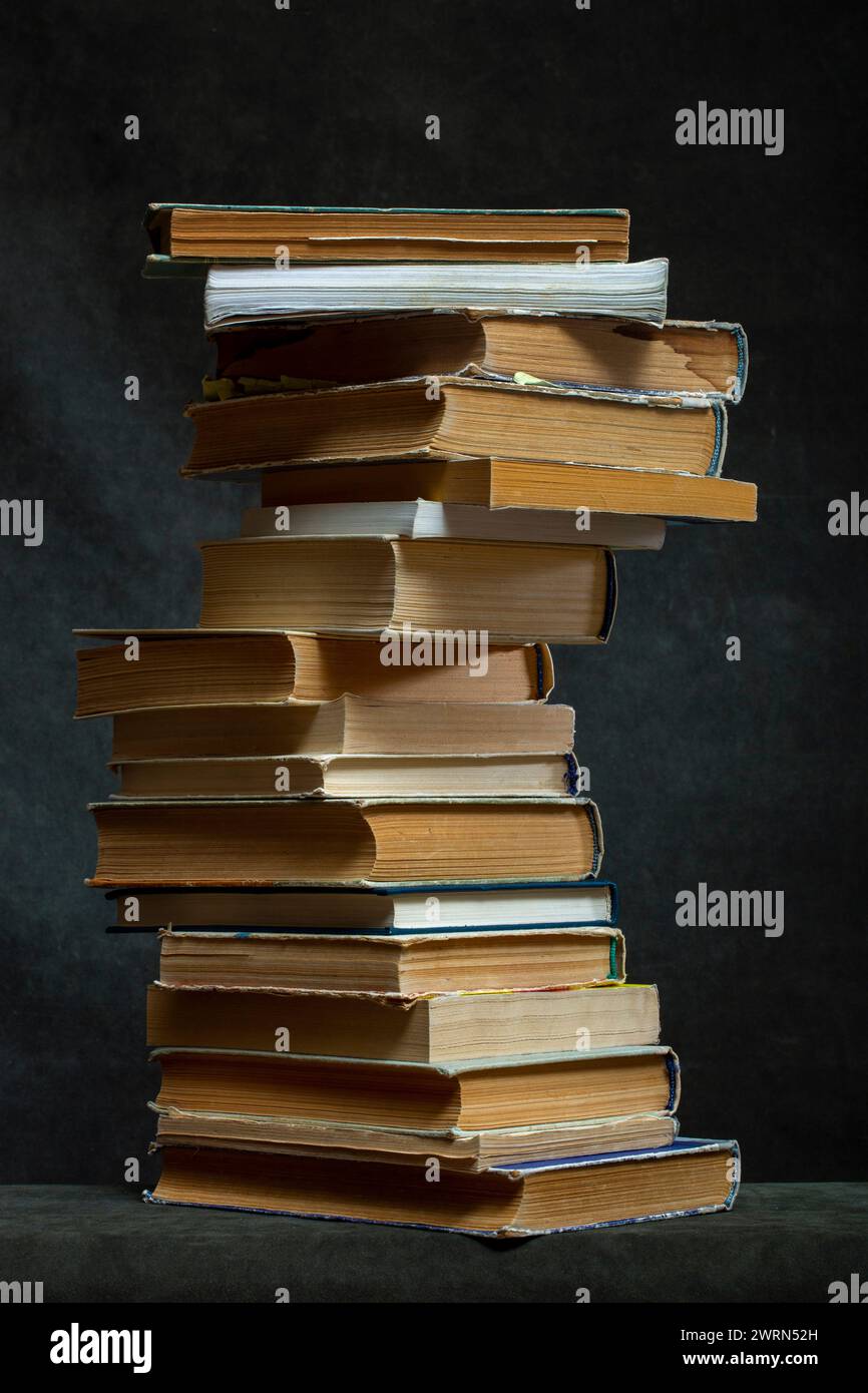 A stack of old books and notebooks on the table Stock Photo