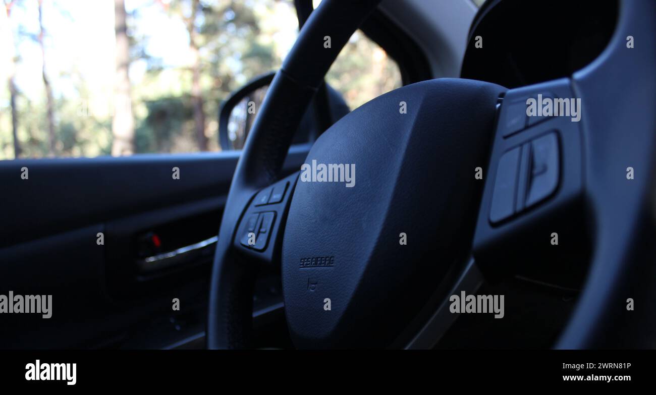 Closeup Angle View Of Steering Wheel Of A Car At Outdoor Parking Stock Photo