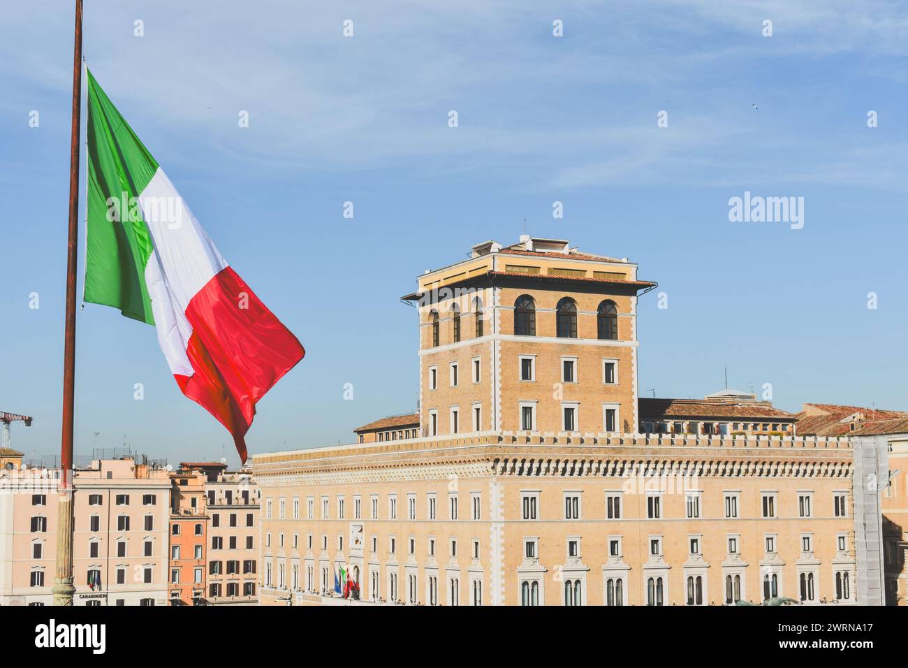 Flag of Italy waving in the sky Stock Photo