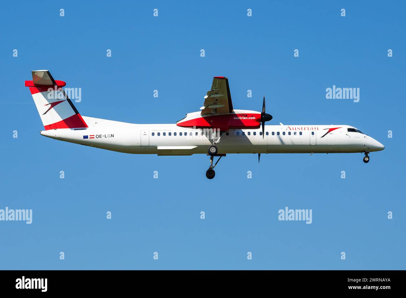 Vienna, Austria - May 13, 2018: Austrian Airlines Bombardier DHC-8 Q400 OE-LGN passenger plane arrival and landing at Vienna Airport Stock Photo