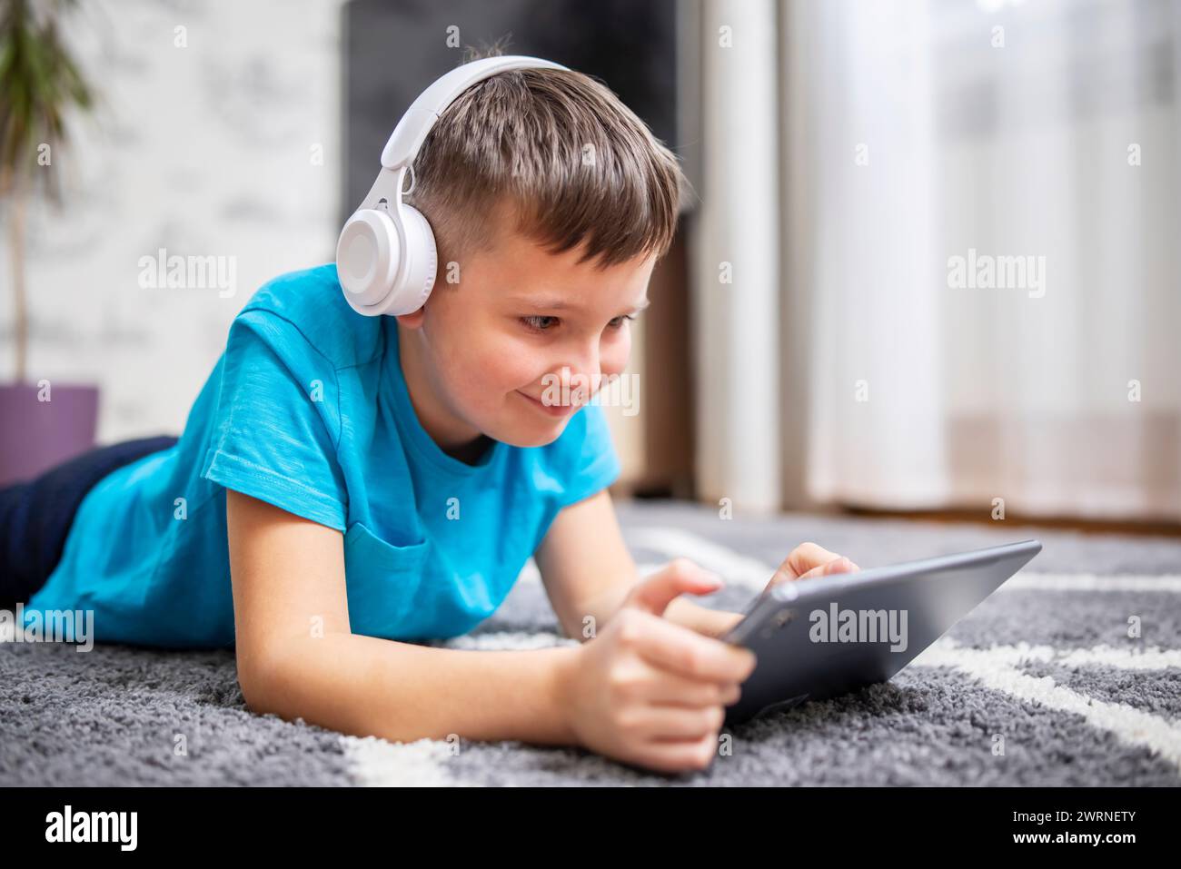 Boy wearing headphones using hi-res stock photography and images - Alamy