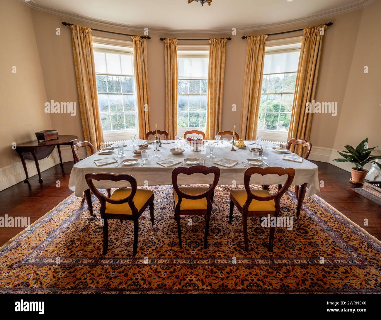 Dining room with table set for dinner at Quarry Bank House. Styal. Cheshire. Stock Photo