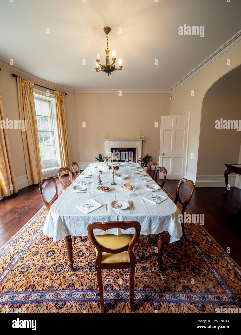 Dining room with table set for dinner at Quarry Bank House. Styal. Cheshire. Stock Photo