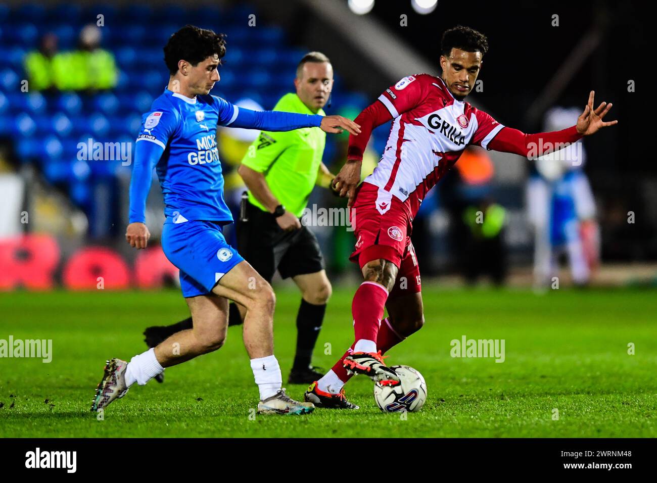 Terence Vancooten (15 Stevenage) challenged by Joel Randall (14 Peterborough United) during the Sky Bet League 1 match between Peterborough and Stevenage at London Road, Peterborough on Wednesday 13th March 2024. (Photo: Kevin Hodgson | MI News) Credit: MI News & Sport /Alamy Live News Stock Photo