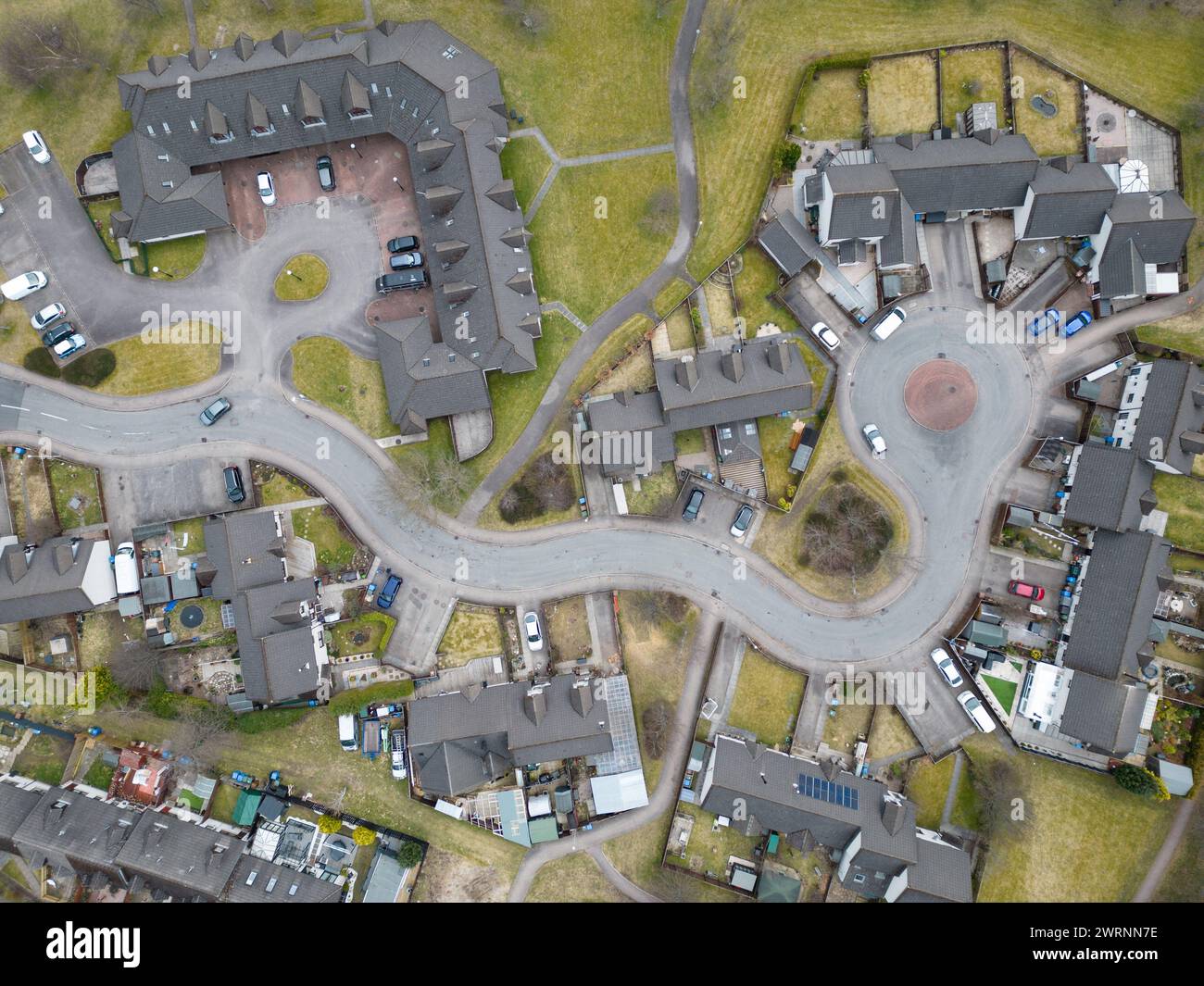 Modern houses in the town of Aviemore in the Scottish Highlands with road designed for traffic calming Stock Photo