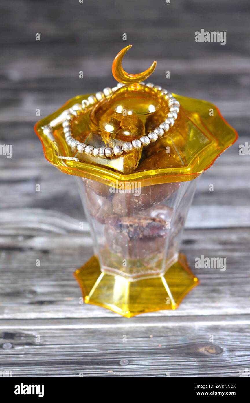 Islamic lantern fanous, silver rosary and chocolate-Covered Dates make ...