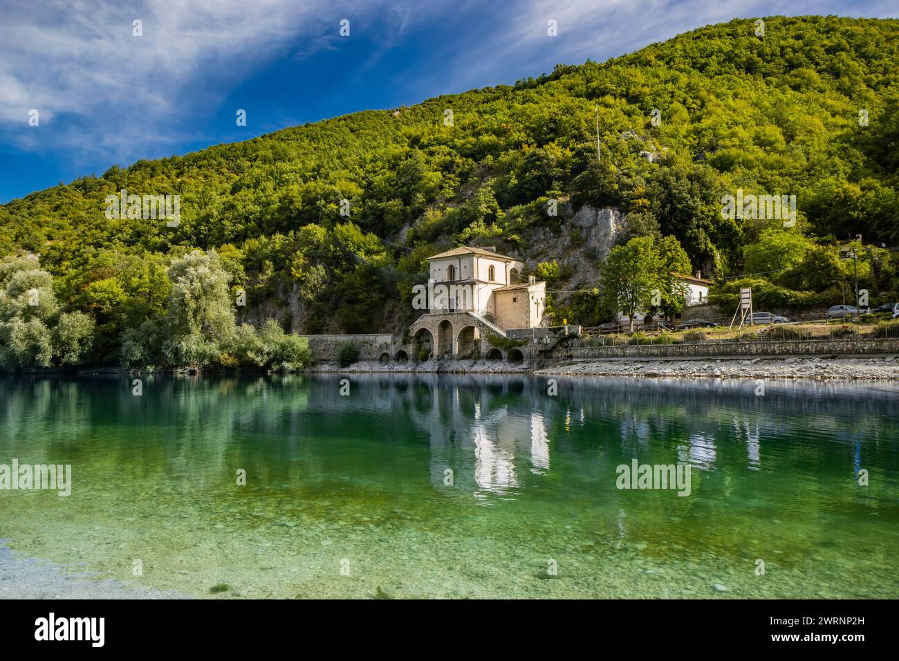 The enchanting Lake Scanno, in Abruzzo, in the province of L'Aquila, located between the Marsican Mountains. The small Church of Santa Maria dell'Annu Stock Photo
