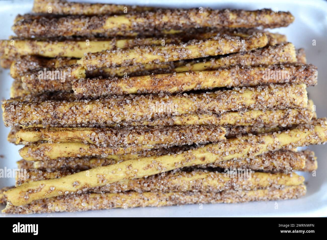 Brown sugar cinnamon breadsticks, grissini, grissino or dipping sticks, baton sale French sticks with cinnamon and topped with brown sugar, pencil-siz Stock Photo