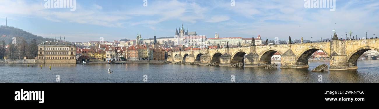 Panoramic view towards Lesser Town and Prague Castle with Charles Bridge on foreground from Smetanovo Embankment in Prague, Czech Republic. Stock Photo