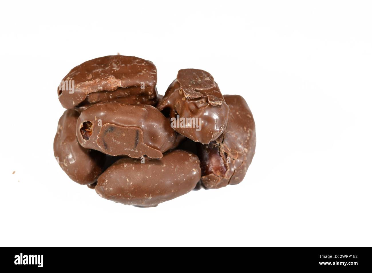 Chocolate-Covered Dates make for the best snack, treat, or dessert, tasty Saudi dates coated with brown chocolate layer, dates usually consumed in Ram Stock Photo