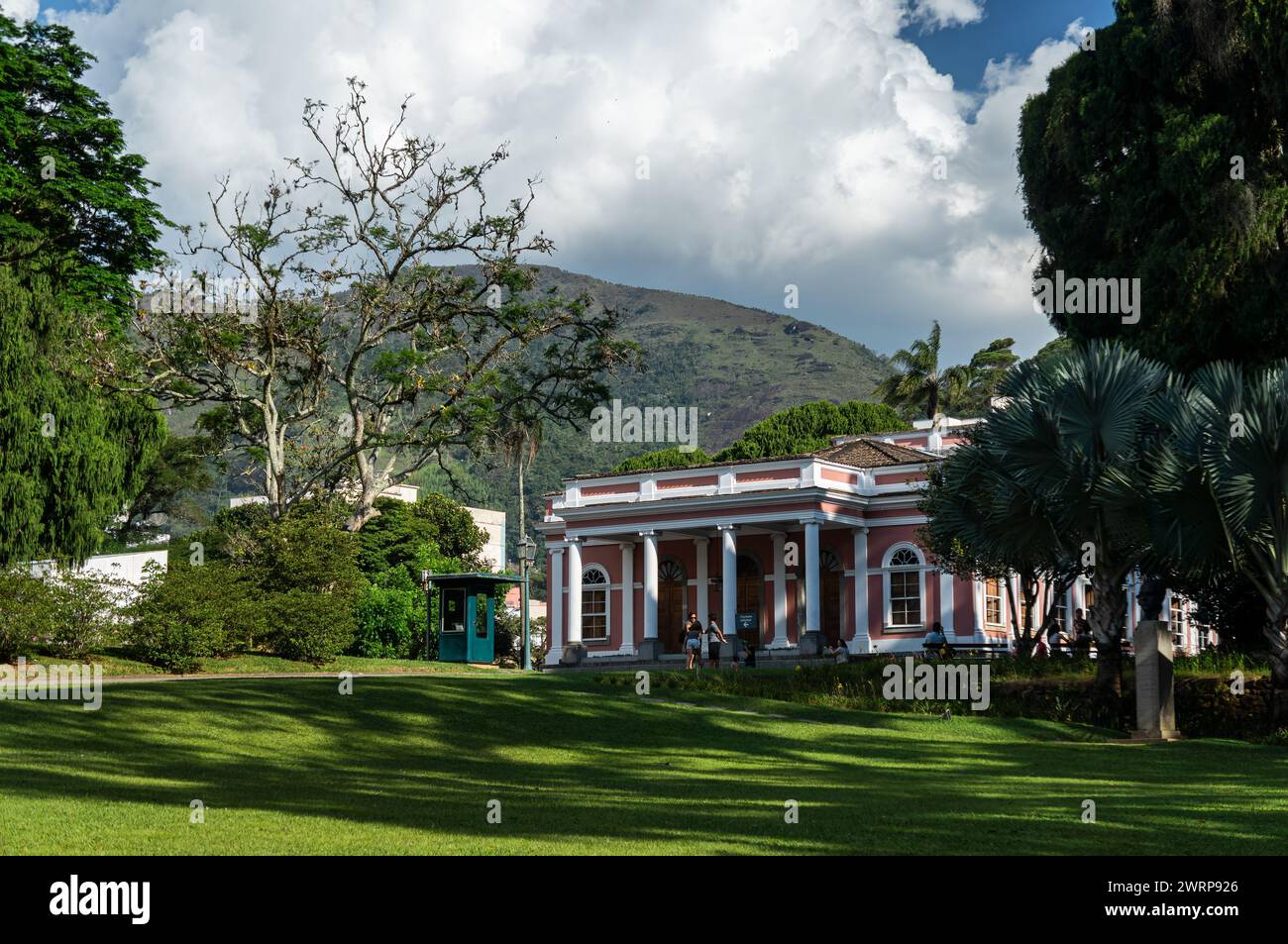 Wide view of the Petropolis Imperial Palace gardens near the museum entrance in Centro district under summer afternoon sunny clouded blue sky. Stock Photo