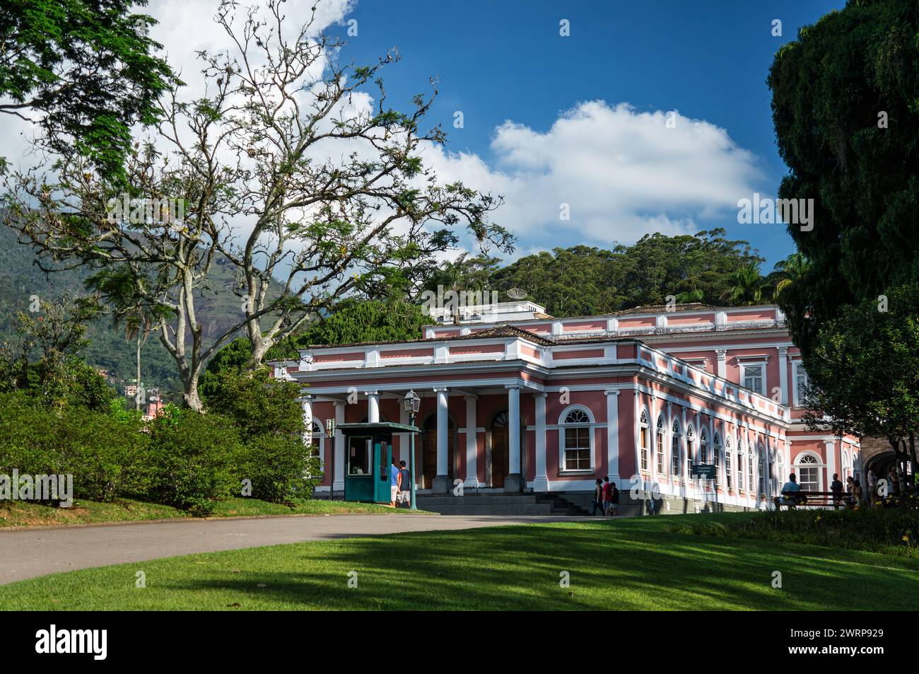 Wide view of the Petropolis Imperial Palace gardens near the museum entrance in Centro district under summer afternoon sunny clouded blue sky. Stock Photo
