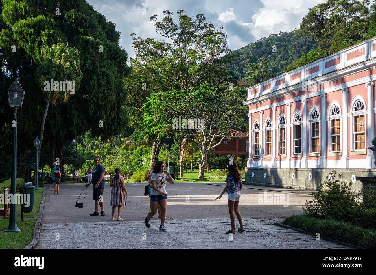 Partial view of the Petropolis Imperial Palace building and the green gardens in Centro district under summer afternoon sunny clouded blue sky. Stock Photo