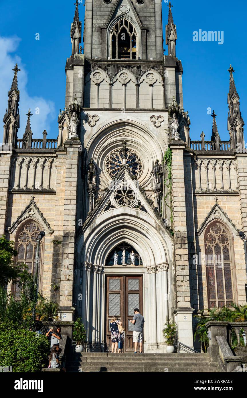 Partial closer view of the main entrance facade of Cathedral of Petropolis in Centro district under summer afternoon sunny clouded blue sky. Stock Photo