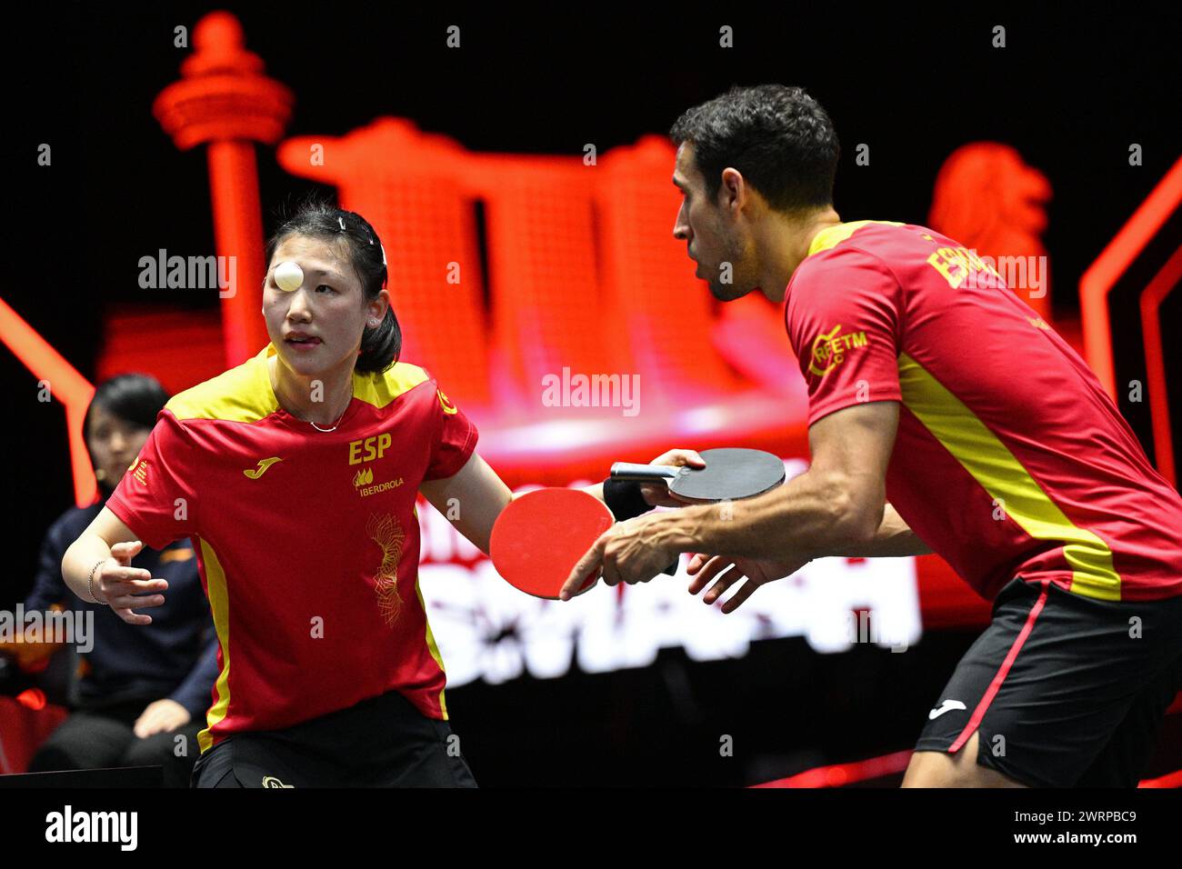 Singapore. 13th Mar, 2024. Maria Xiao (L)/Alvaro Robles of Spain compete during the mixed doubles quarterfinal against Sun Yingsha/Wang Chuqin of China at the World Table Tennis Singapore Smash 2024 in Singapore, March 13, 2024. Credit: Then Chih Wey/Xinhua/Alamy Live News Stock Photo