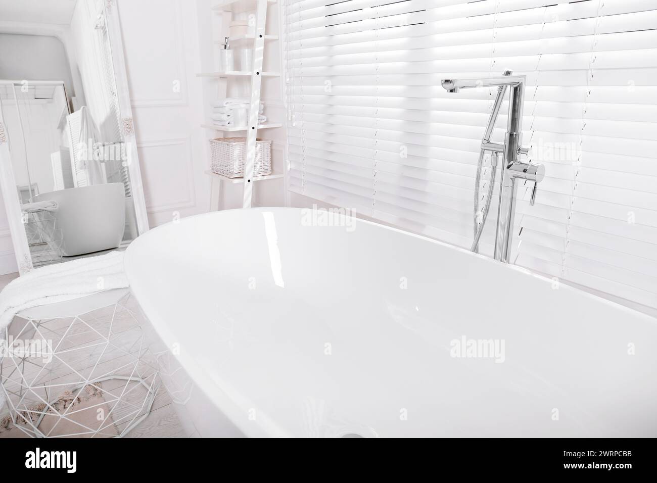 Modern white tub in bathroom. Interior design Stock Photo - Alamy