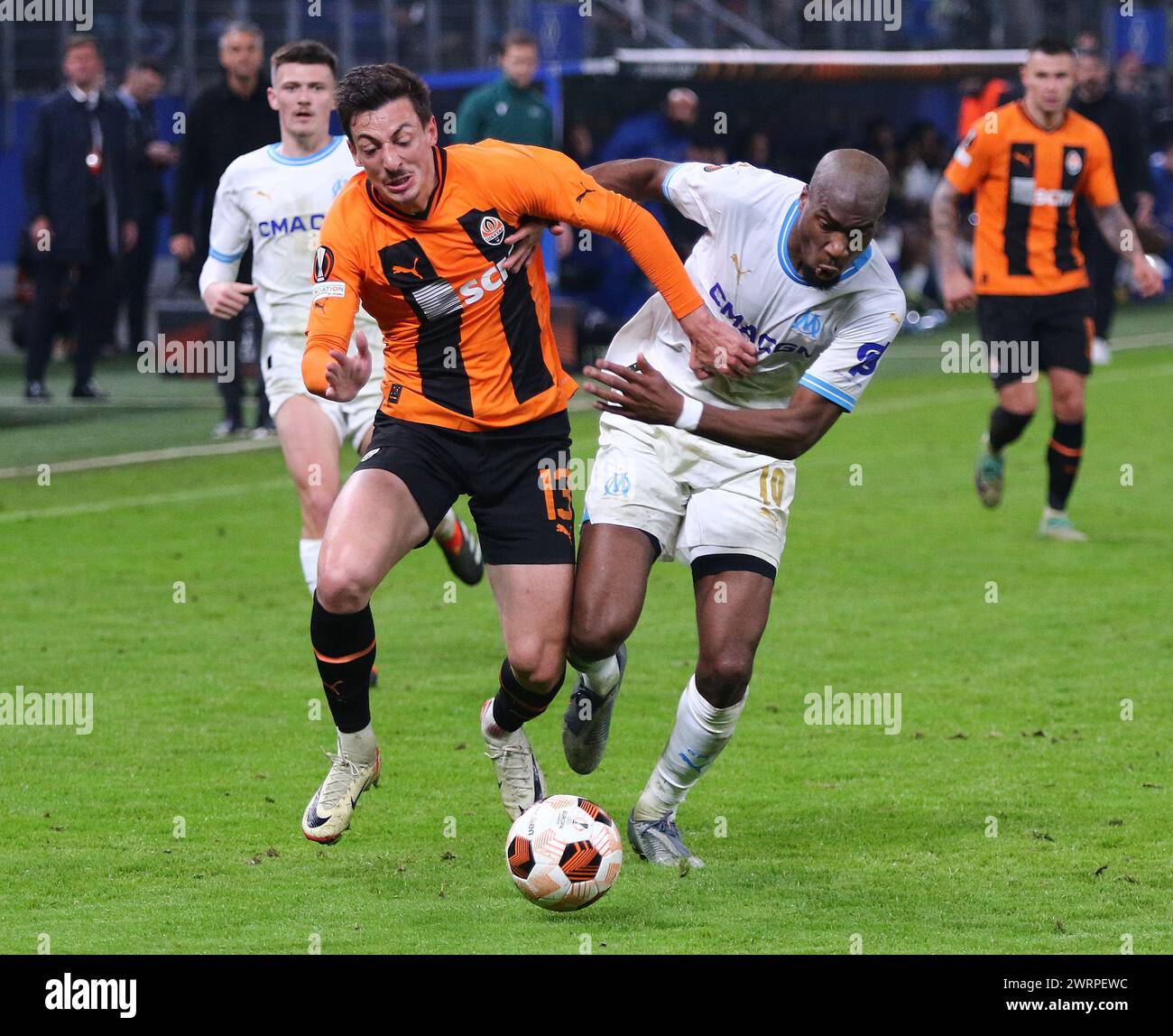 Hamburg, Germany - February 15, 2024: Giorgi Gocholeishvili of Shakhtar Donetsk (L) fights for a ball with Geoffrey Kondogbia of Marseille during their UEFA Europa League game at Volksparkstadion Stock Photo